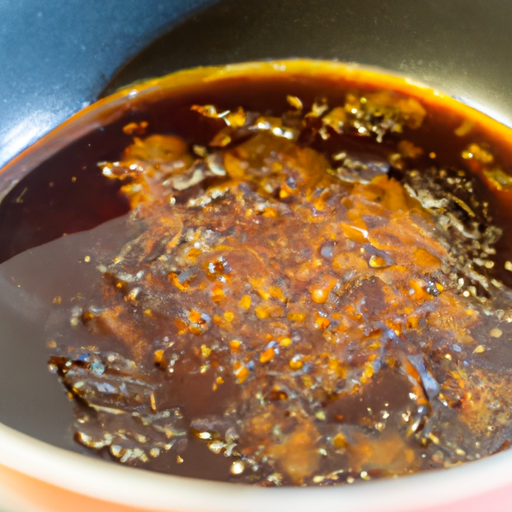 Homemade honey balsamic glaze simmering in a saucepan