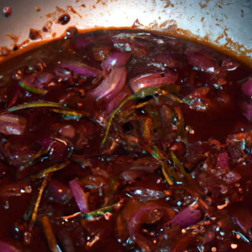 A close-up of a simmering red wine sauce in a pan, with shallots and herbs.