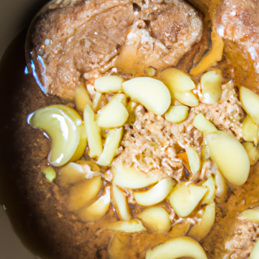 Close-up of a bowl of soy ginger glaze with visible ginger and garlic bits, ready to be brushed onto the steak